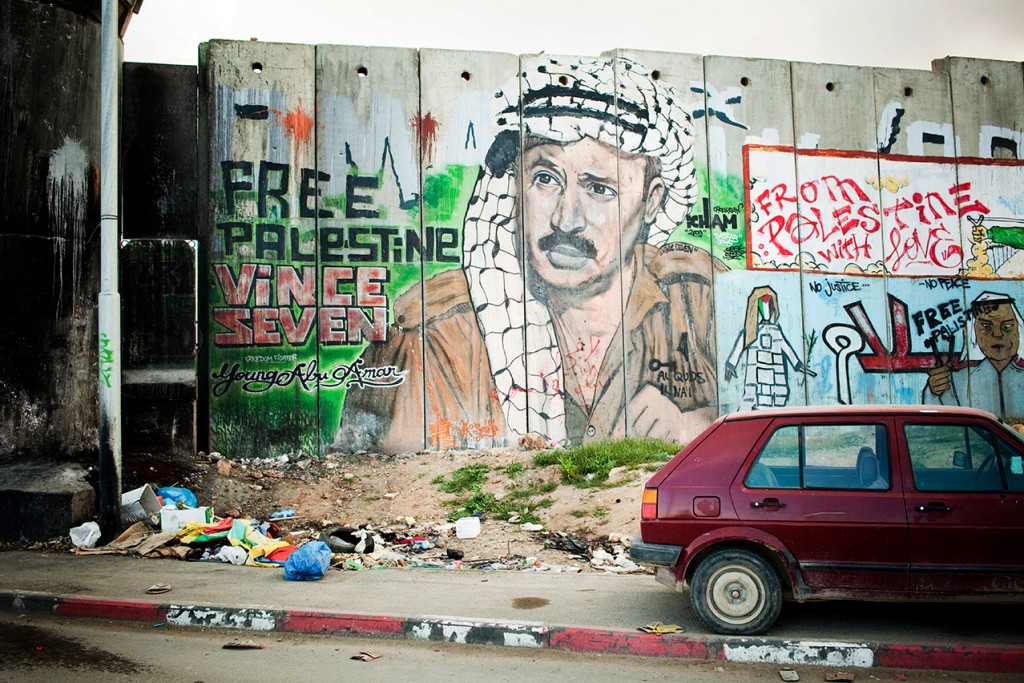RAMALLAH, PALESTINIAN TERRITORIES - APRIL 2011. The separation wall otherwise called security fence by the Israelis. At the entrance of Ramallah. It surrounds part of the city and separates it from Jerusalem. To cross it, you have to take checkpoints.